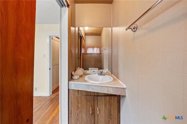 1820 S 49th St, Temple, TX 76504 - bathroom with vanity and wood finished floors