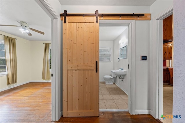 1820 S 49th St, Temple, TX 76504 - bathroom with a ceiling fan, hardwood / wood-style floors, and plenty of natural light