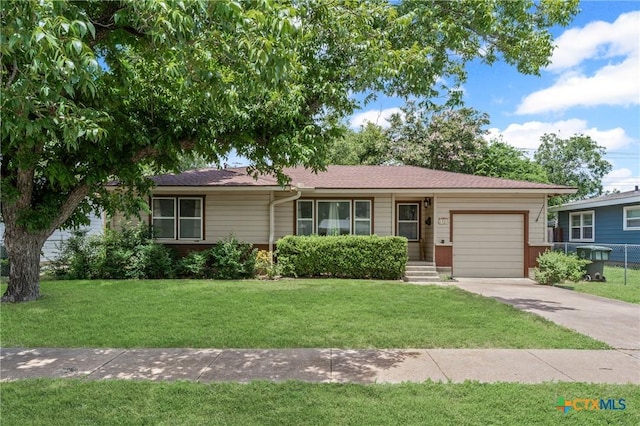 1820 S 49th St, Temple, TX 76504 - ranch-style home featuring a garage, a front yard, and concrete driveway