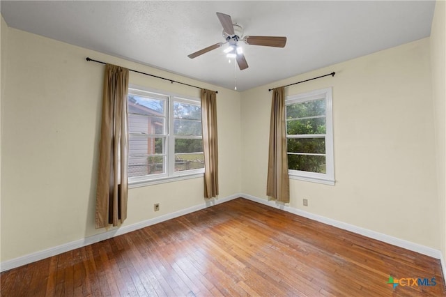 1820 S 49th St, Temple, TX 76504 - empty room with hardwood / wood-style floors, plenty of natural light, and ceiling fan