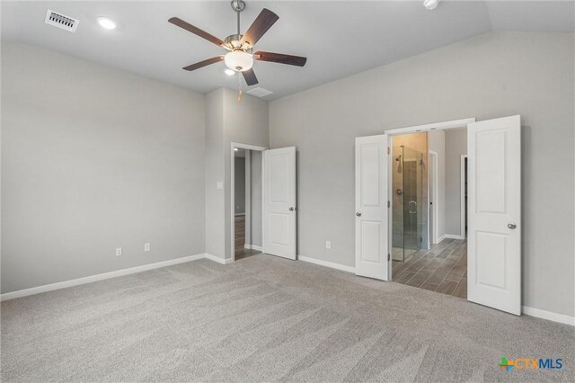 416 Stellar Wind Dr, Georgetown, TX 78628 - unfurnished bedroom featuring ensuite bath, vaulted ceiling, ceiling fan, and carpet