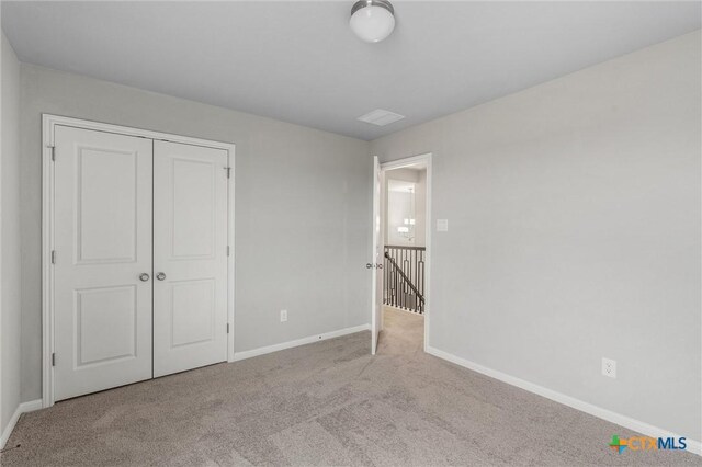 416 Stellar Wind Dr, Georgetown, TX 78628 - unfurnished bedroom with a closet and light carpet