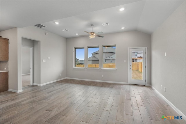 416 Stellar Wind Dr, Georgetown, TX 78628 - unfurnished living room with ceiling fan, lofted ceiling, and light wood-type flooring