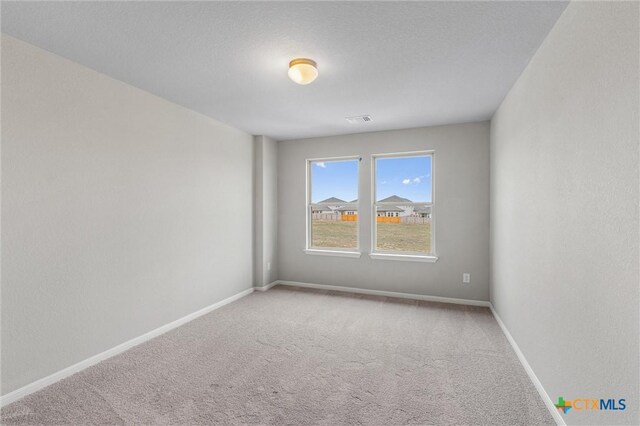 416 Stellar Wind Dr, Georgetown, TX 78628 - empty room featuring carpet flooring and a textured ceiling