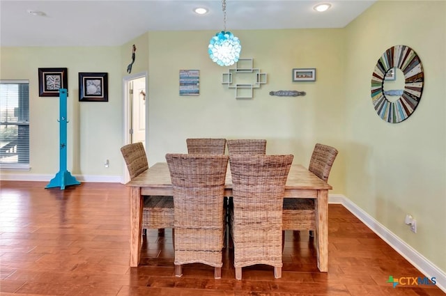 dining area featuring recessed lighting, wood finished floors, and baseboards