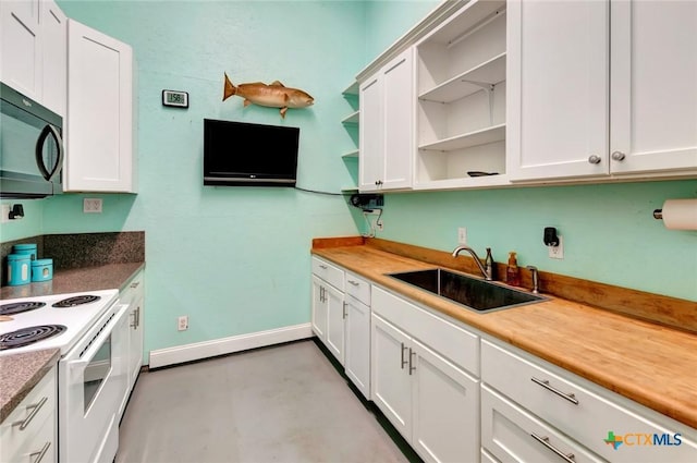 kitchen featuring a sink, black microwave, electric range, white cabinets, and open shelves