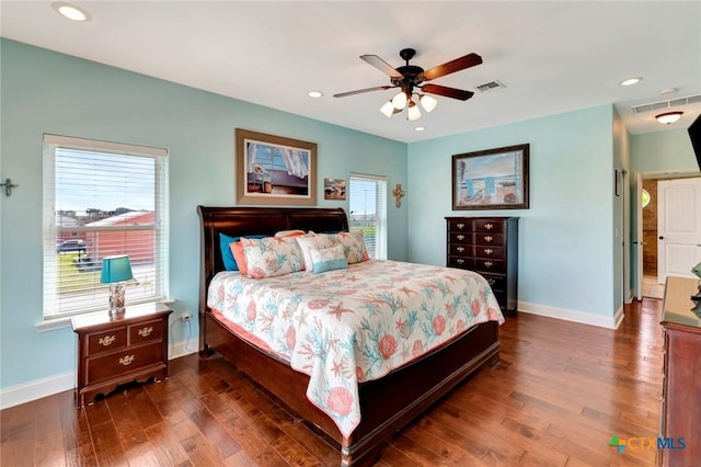 bedroom featuring visible vents, recessed lighting, dark wood-style floors, and baseboards