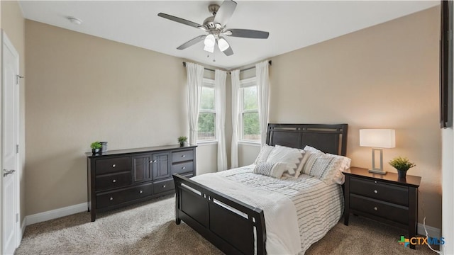 bedroom with carpet flooring, baseboards, and ceiling fan