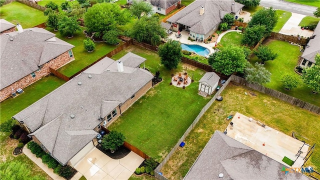aerial perspective of suburban area featuring a pool area