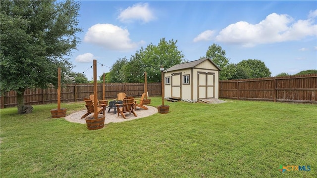 view of yard featuring an outdoor fire pit, a storage shed, an outdoor structure, and a patio area