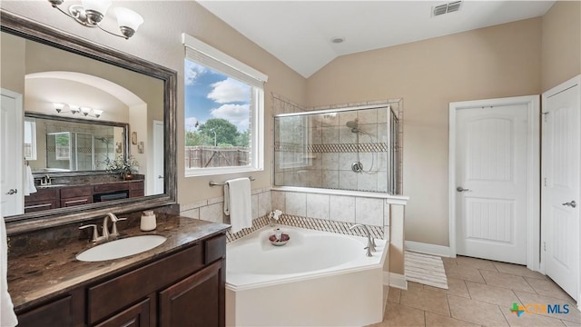 full bath featuring a shower stall, vaulted ceiling, a bath, tile patterned flooring, and vanity