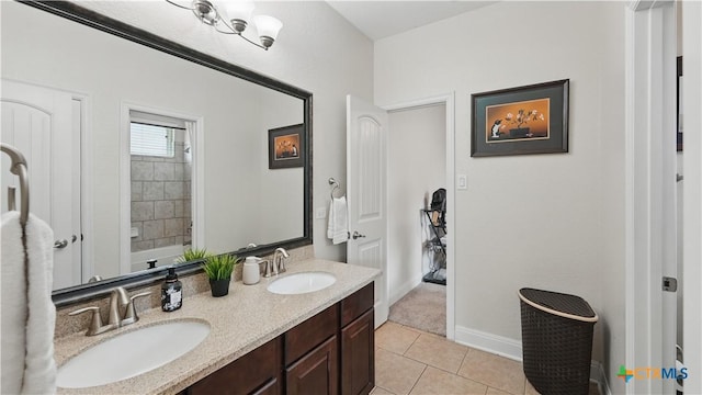 full bath with tile patterned flooring, double vanity, baseboards, and a bath