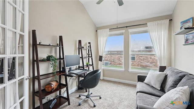carpeted office space with lofted ceiling, baseboards, and ceiling fan