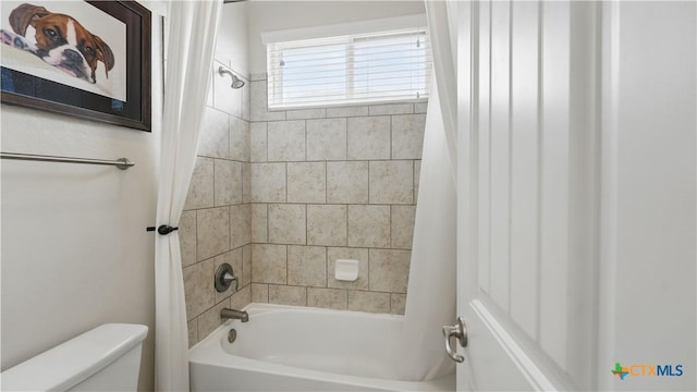 full bath featuring toilet and shower / bath combination with curtain