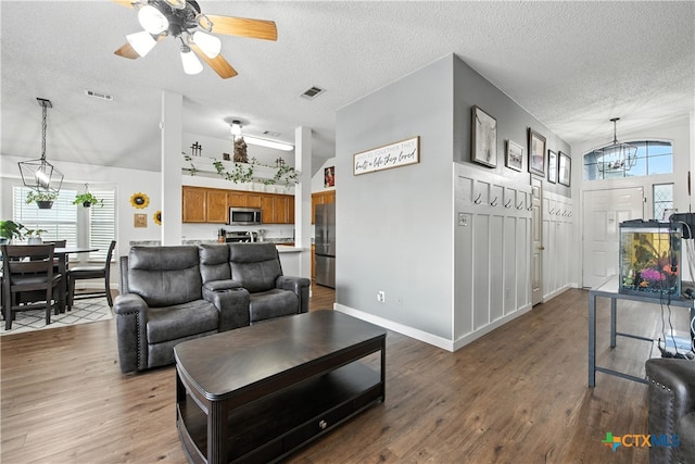 604 Totem Trl, Harker Heights, TX 76548 - living room featuring a chandelier, a textured ceiling, vaulted ceiling, wood finished floors, and a ceiling fan
