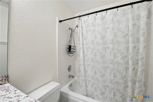 604 Totem Trl, Harker Heights, TX 76548 - full bathroom featuring shower / bath combo with shower curtain, vanity, and a textured wall
