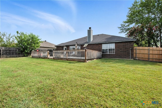 604 Totem Trl, Harker Heights, TX 76548 - rear view of property featuring brick siding, a chimney, a fenced backyard, and a wooden deck