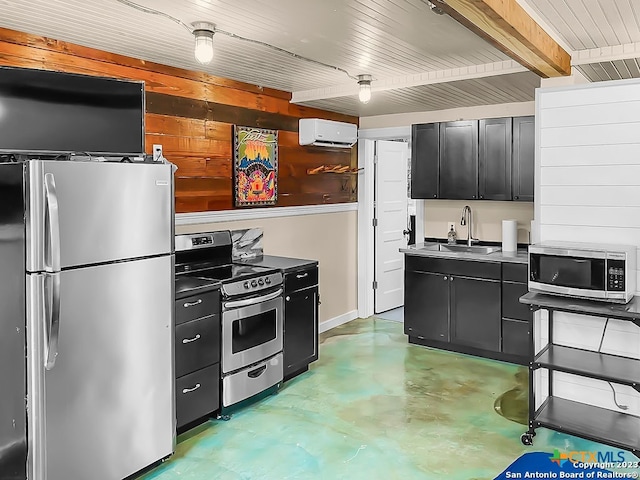 kitchen featuring an AC wall unit, sink, and stainless steel appliances