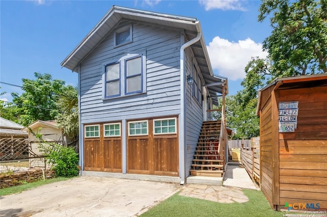 back of house with a garage