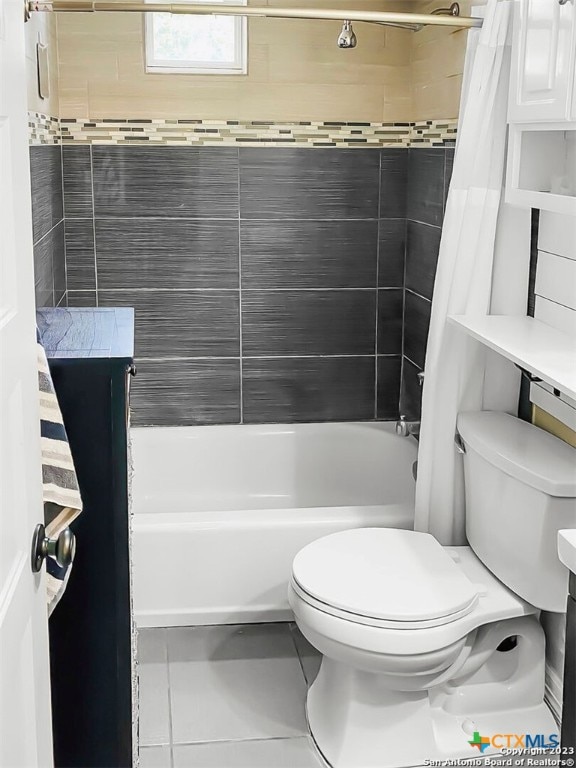 bathroom featuring toilet, shower / bath combo, and tile patterned flooring