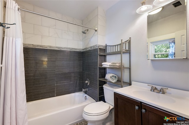 full bathroom featuring vanity, toilet, and shower / tub combo