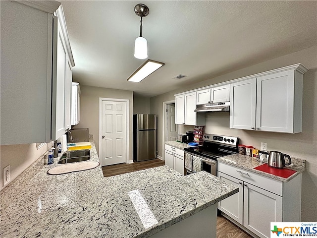 kitchen with dark hardwood / wood-style floors, white cabinetry, and appliances with stainless steel finishes