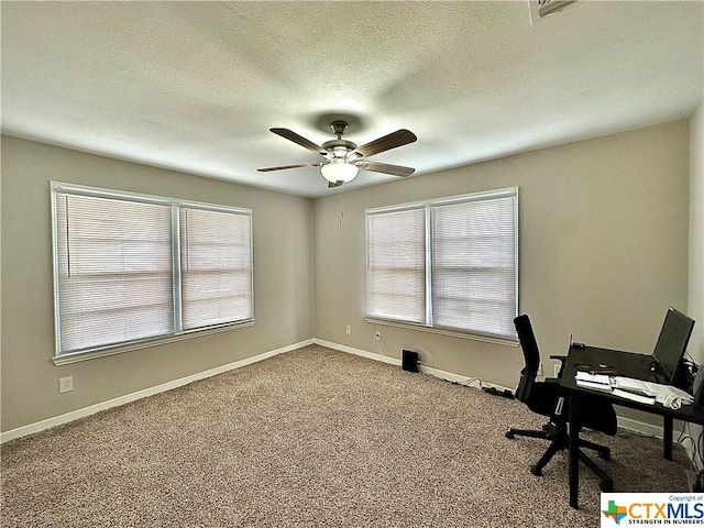 office space with a textured ceiling, carpet flooring, and ceiling fan