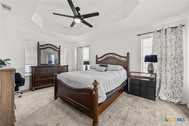 3704 Dewitt County Ct, Killeen, TX 76549 - bedroom with a tray ceiling, light carpet, crown molding, and ceiling fan