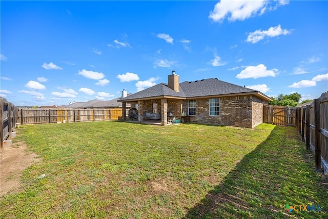 3704 Dewitt County Ct, Killeen, TX 76549 - rear view of house with brick siding, a chimney, and a patio area