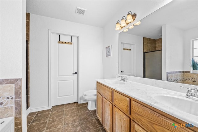 3704 Dewitt County Ct, Killeen, TX 76549 - bathroom featuring a shower stall, double vanity, a bath, and toilet