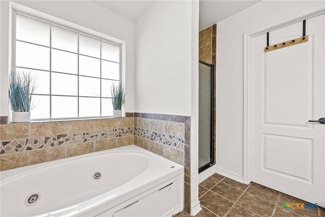 3704 Dewitt County Ct, Killeen, TX 76549 - bathroom featuring plenty of natural light, a shower stall, and a tub with jets