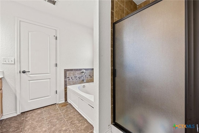3704 Dewitt County Ct, Killeen, TX 76549 - full bath featuring a stall shower, a garden tub, and tile patterned floors