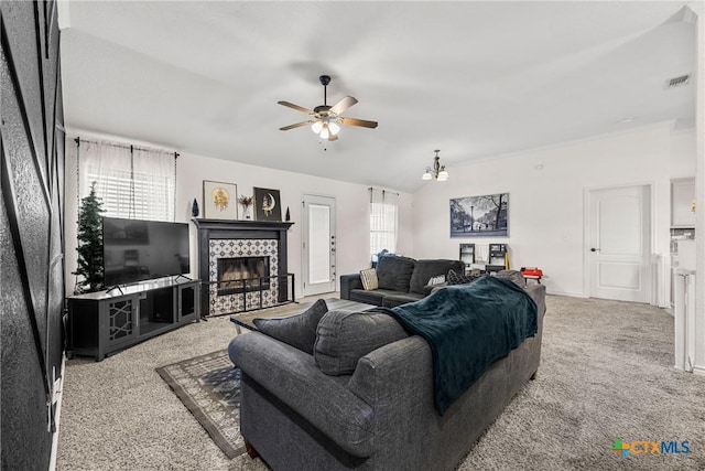 3704 Dewitt County Ct, Killeen, TX 76549 - carpeted living room featuring a ceiling fan, a tiled fireplace, and lofted ceiling