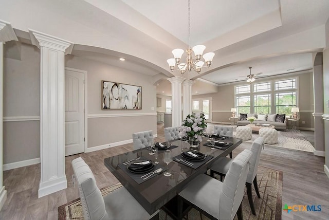 142 Merion Ln, La Vernia, TX 78121 - dining area featuring ornate columns, arched walkways, baseboards, a ceiling fan, and recessed lighting