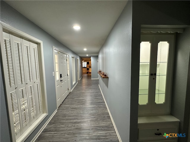 hall featuring french doors and dark wood-type flooring