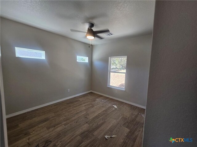 unfurnished bedroom featuring a closet and dark hardwood / wood-style floors