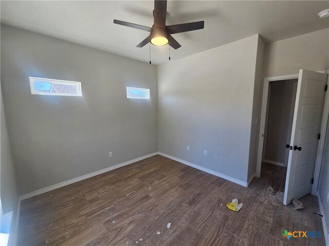 unfurnished bedroom featuring dark wood-type flooring