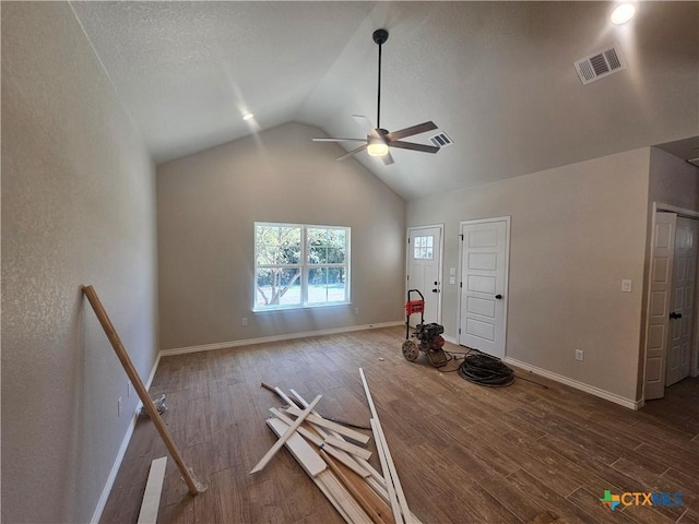 interior space with a ceiling fan, baseboards, visible vents, and wood finished floors