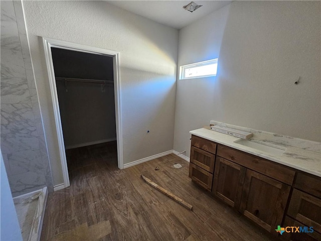 bathroom featuring vanity and hardwood / wood-style flooring