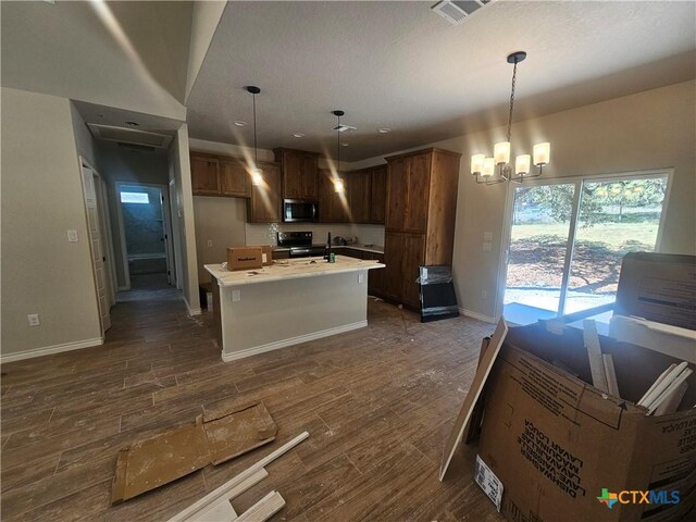 kitchen with a kitchen island, high vaulted ceiling, and light hardwood / wood-style flooring