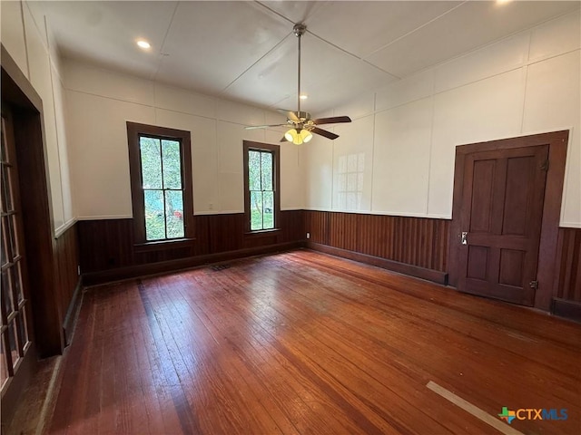 184 3rd St, Maxwell, TX 78656 - unfurnished room featuring hardwood / wood-style flooring, wainscoting, ceiling fan, and recessed lighting