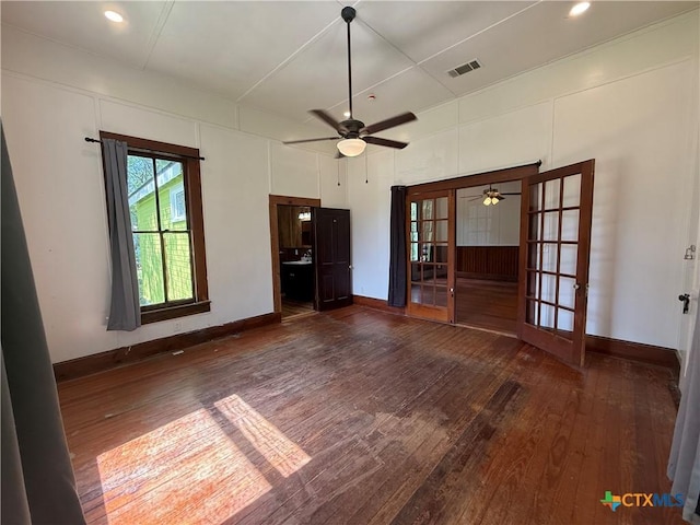 184 3rd St, Maxwell, TX 78656 - empty room featuring french doors, dark wood-type flooring, ceiling fan, and recessed lighting