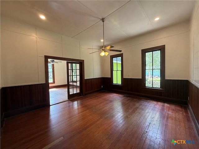 184 3rd St, Maxwell, TX 78656 - unfurnished room with hardwood / wood-style flooring, ceiling fan, wainscoting, and recessed lighting
