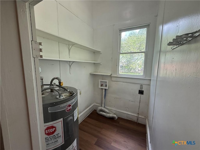 184 3rd St, Maxwell, TX 78656 - washroom featuring electric water heater, hookup for a washing machine, and dark wood-style floors