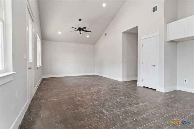 spare room with high vaulted ceiling and ceiling fan