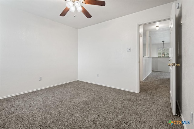 carpeted empty room featuring ceiling fan