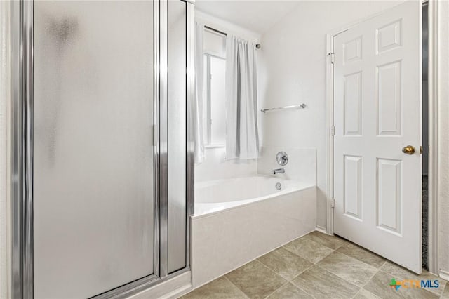 bathroom featuring tile patterned flooring and plus walk in shower