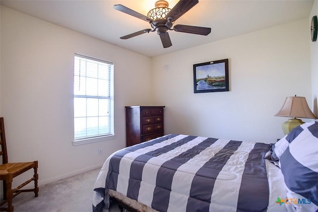 bedroom with baseboards, carpet floors, and a ceiling fan