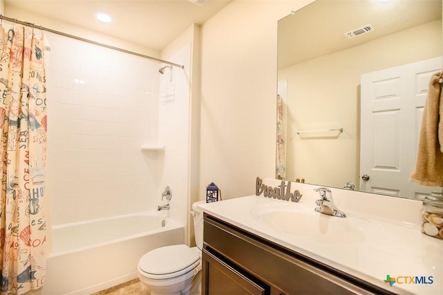 full bathroom featuring visible vents, toilet, vanity, and shower / bathtub combination with curtain