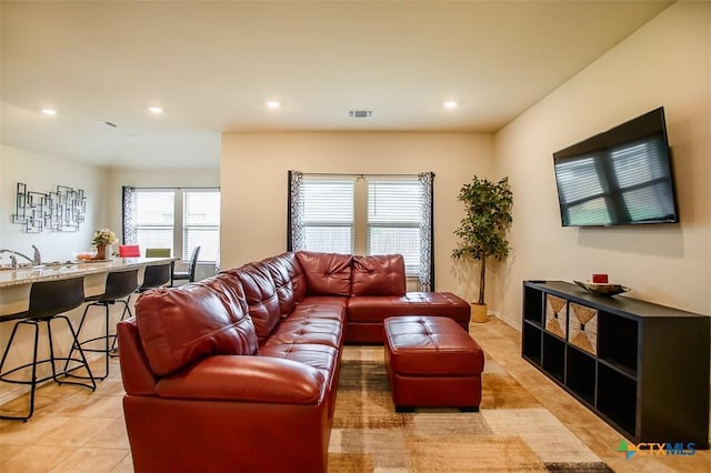 living room with recessed lighting, visible vents, and light tile patterned floors